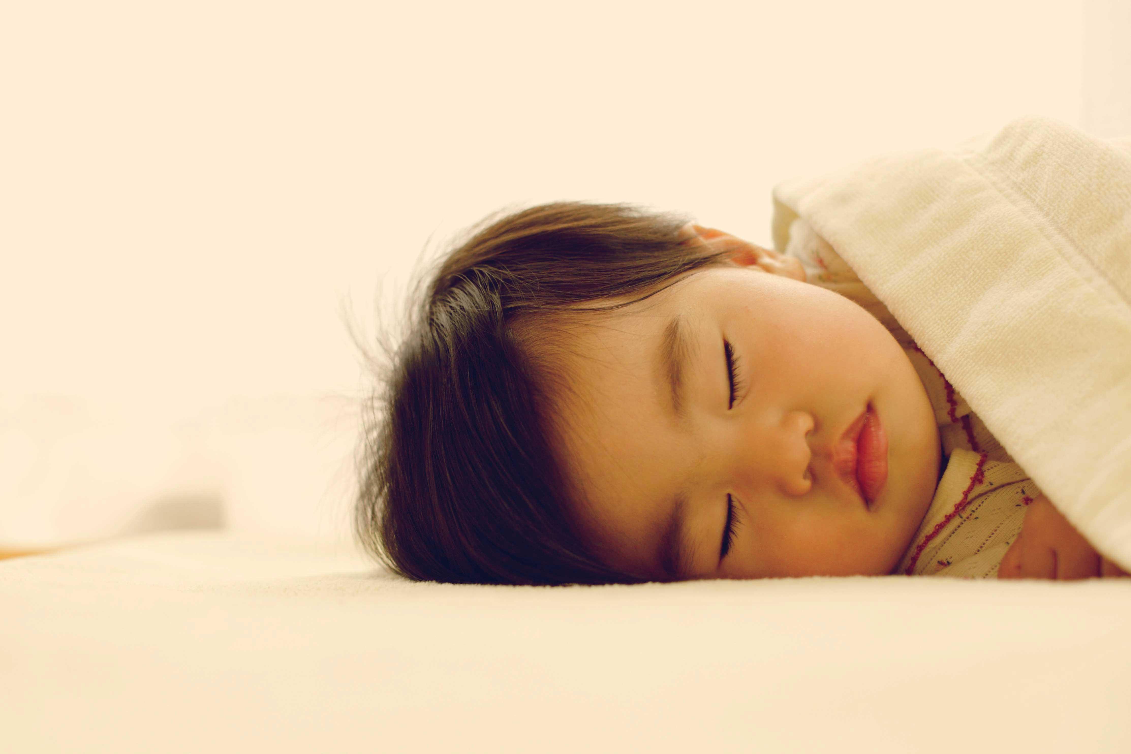 Baby sleeping with a blanket